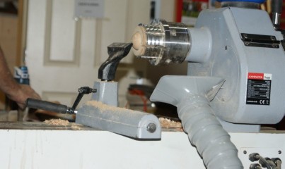 The head held in a sphere chuck to prepare for the eye